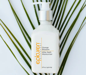 Epicuren Discovery After Bath Body Moisturizer in Orange Blossom, showcasing a luxurious lotion bottle with floral accents.