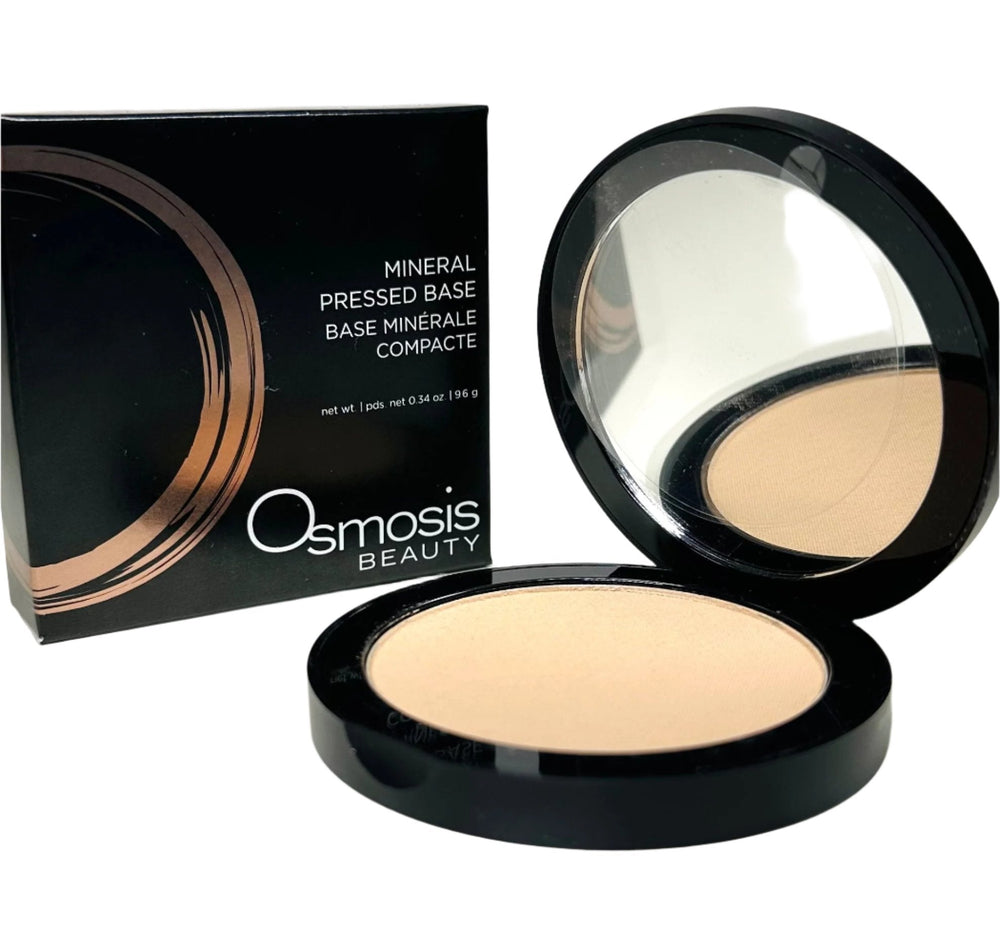 Osmosis Beauty Mineral Pressed Base compact with a smooth texture and natural finish, ideal for flawless makeup application.