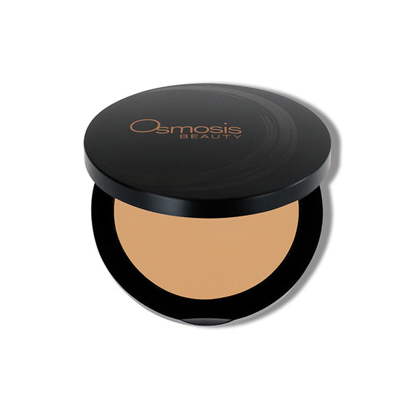 Osmosis Beauty Mineral Pressed Base compact in Natural Dark shade with a smooth finish and sleek packaging.