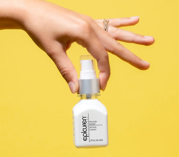 Epicuren Discovery Muscle Relief Arnica Cream in a lifestyle setting, showcasing the cream's texture and packaging.