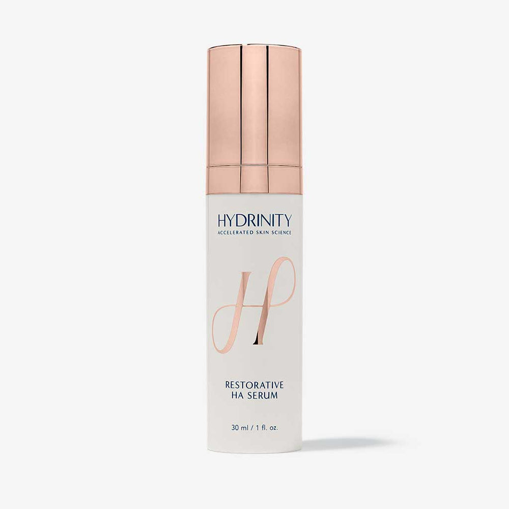 Hydrinity Restorative HA Serum in a glass bottle, featuring dropper applicator and clear liquid formula for hydrating skin.
