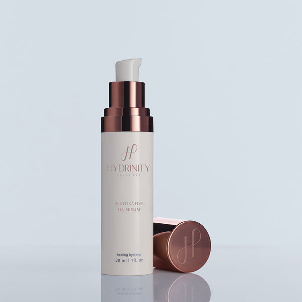 Hydrinity Restorative Kit featuring a blue serum cap for optimal hydration and skin restoration.