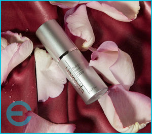 Epicuren Discovery Bulgarian Rose Otto, 0.5 Fl Oz, anti-aging serum with a glass dropper and rose petals in the background.