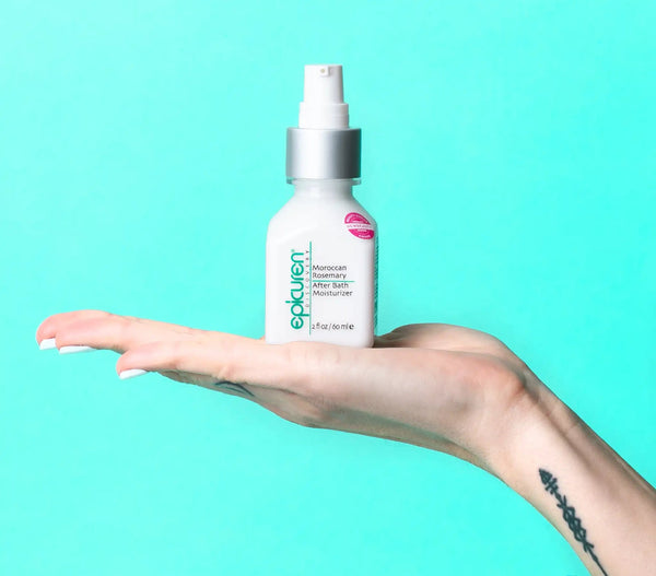 Epicuren Discovery Moroccan Rosemary After Bath Body Moisturizer in a lifestyle setting with rosemary leaves and a soft towel.