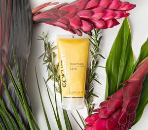 Epicuren Discovery Rosemary Lave Body Cleanser bottle with rosemary sprigs on a wooden surface, showcasing its natural ingredients.