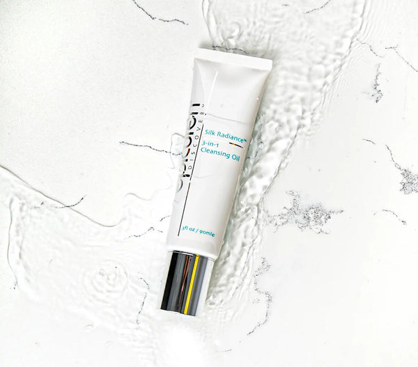 Epicuren Discovery Silk Radiance 3-IN-1 Cleansing Oil in a stylish bottle with a soft, glowing backdrop.
