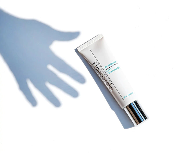 Epicuren Discovery Silk Radiance 3-IN-1 Cleansing Oil bottle with a sleek design on a natural background.