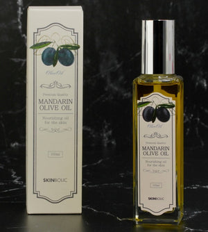 Skinbolic Mandarin Olive Oil SPF 100ml bottle with a sleek design, showcasing vibrant mandarin graphics.