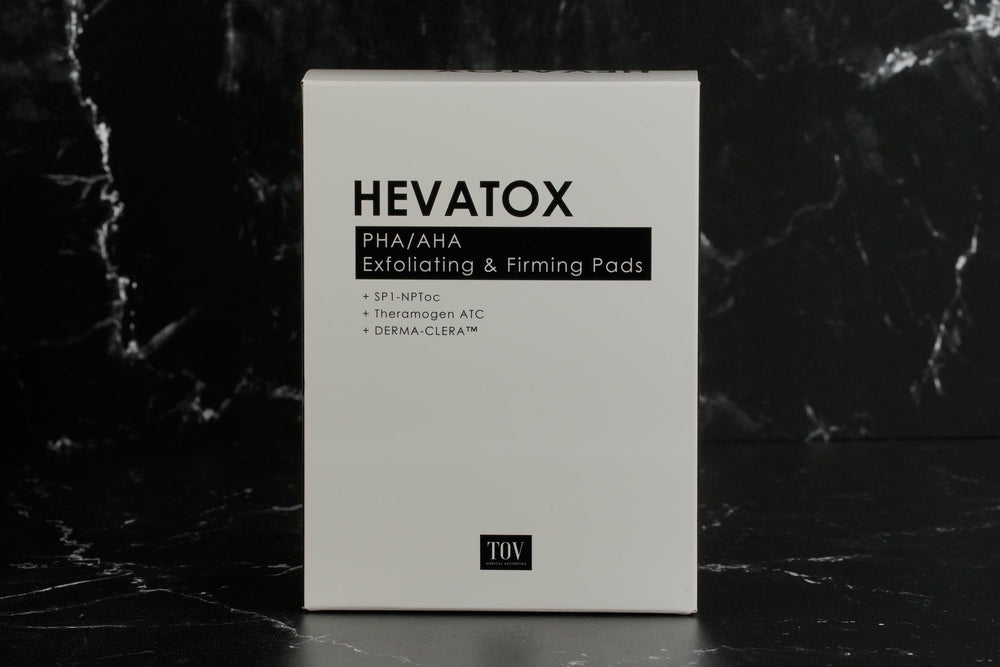 TOV Hevatox PHA/AHA exfoliating and firming pads in a jar with pads visible, showcasing the product's texture and design.