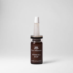 Le Mieux StemCell EGF serum in a glass ampoule, showcasing the skincare product designed to promote skin regeneration and vitality.