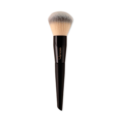 Osmosis Beauty The Powder Brush featuring soft bristles and a sleek handle for flawless application of skincare products.