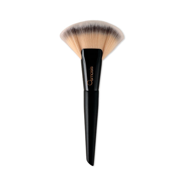 Osmosis Beauty Ultimate Fan Brush, a sleek skincare tool with soft bristles for precise application.