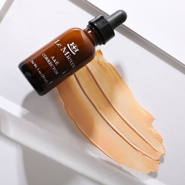 Le Mieux A&E Corrector exfoliant in a sleek jar with a gold lid, showcasing its smooth, creamy texture for skincare.