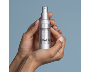Jan Marini Age Intervention Retinol Plus for dark spots in a sleek bottle with a pump dispenser.