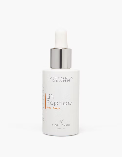 Viktoria DéAnn Lift Peptide serum bottle with a sleek design, showcasing its lightweight texture and brand label.