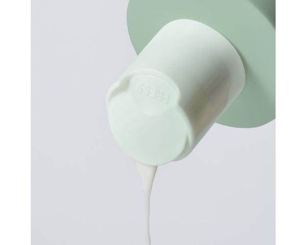 Jan Marini Bioglycolic Face Cleanser in a bathroom setting, showcasing the bottle and its sleek design.