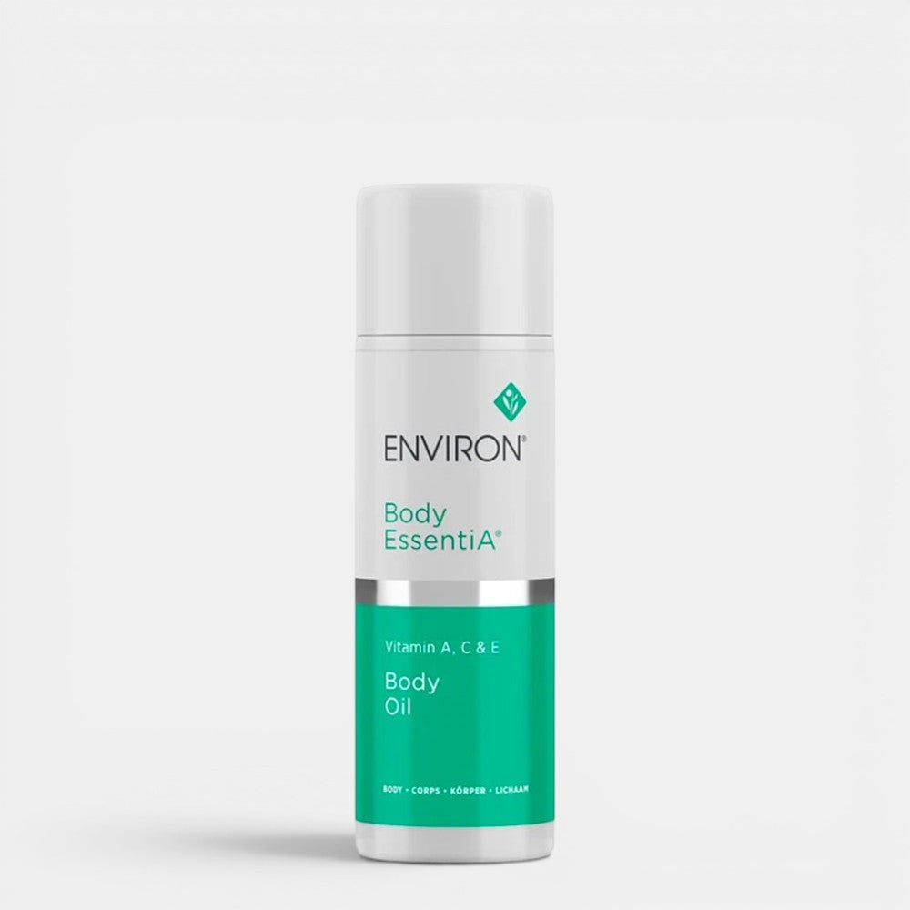 Environ Vitamin A, C & E Body Oil bottle with golden cap and clear body, showing the nourishing body care product.