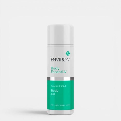 Environ Vitamin A, C & E Body Oil bottle with golden cap and clear body, showing the nourishing body care product.