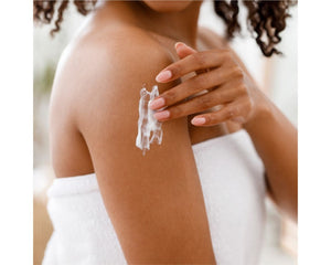 Jan Marini BodyTX body scrub in a jar with a textured scrub surface, showcasing its creamy consistency and packaging.