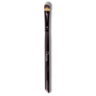 Osmosis Beauty concealer brush with soft bristles for precise application of makeup and skincare products.