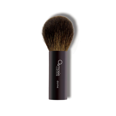 Osmosis Beauty Dome Powder Brush with soft bristles, ideal for applying skincare and makeup products smoothly.