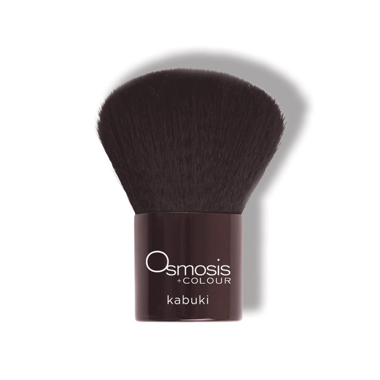 Osmosis Beauty Kabuki Brush with soft bristles for even application of skincare products on the skin.