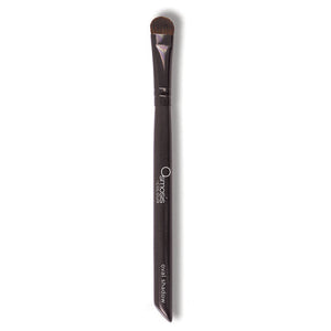 Osmosis Beauty oval shadow brush with soft bristles, designed for precise application of eyeshadow.