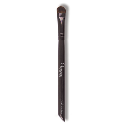 Osmosis Beauty oval shadow brush with soft bristles, designed for precise application of eyeshadow.