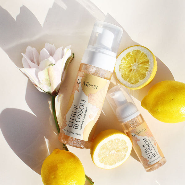 Le Mieux Citrus Blossom Foaming Hand Wash in a bottle with a foamy texture and citrusy floral design.