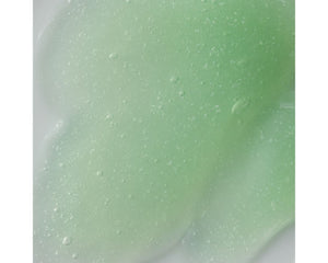 Jan Marini Clean Zyme cleanser bottle with a minimalist design, showcasing its label and texture on a neutral background.