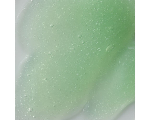 Jan Marini Clean Zyme cleanser bottle with a minimalist design, showcasing its label and texture on a neutral background.