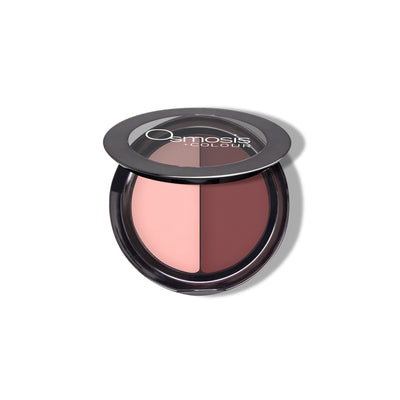Osmosis Beauty Eye Shadow Duo featuring crimson and cream shades in a sleek compact with dual applicator.