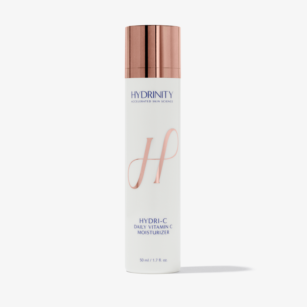 Hydrinity HydrI-C daily vitamin C moisturizer in a white jar with a blue label, showing the product lid and packaging details.