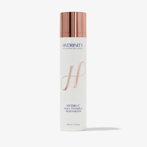 Hydrinity HydrI-C daily vitamin C moisturizer in a white jar with a blue label, showing the product lid and packaging details.