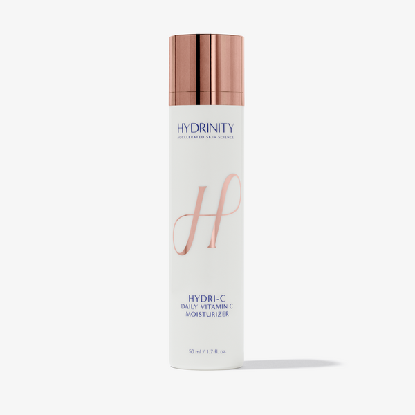 Hydrinity HydrI-C daily vitamin C moisturizer in a white jar with a blue label, showing the product lid and packaging details.