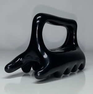 Black Halylo fascia facial and body massage tool with G-types design for effective chin and body massage.