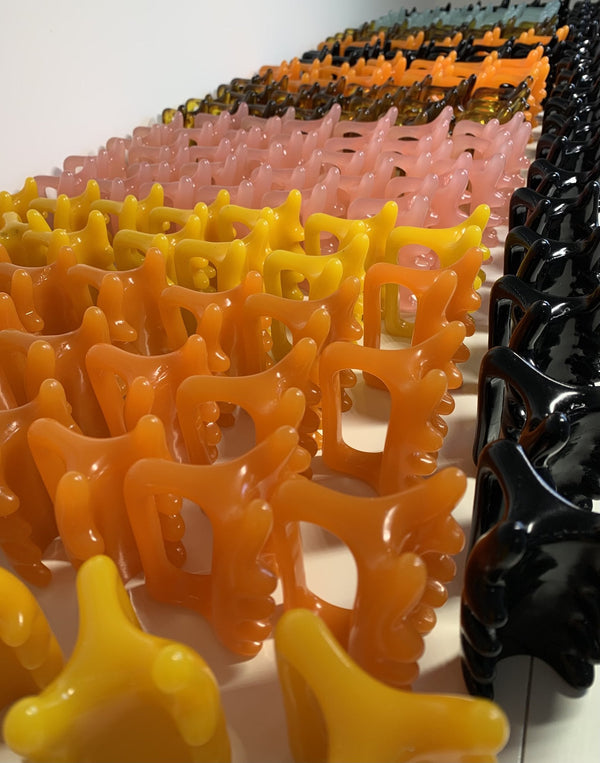 Halylo Fascia Facial and Body Massage Tool in yellow, designed for chin and body massage, showcasing ergonomic design.