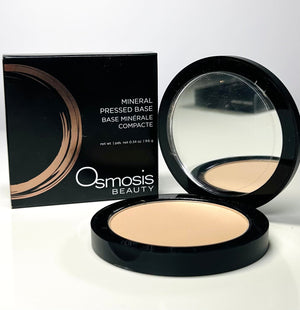 Osmosis Beauty Mineral Pressed Base compact with smooth, even texture and natural skin tone shade.