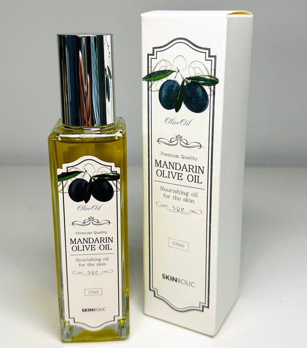 Skinbolic Mandarin Olive Oil SPF in a 100ml bottle with a vibrant mandarin design, showcasing its natural ingredients.