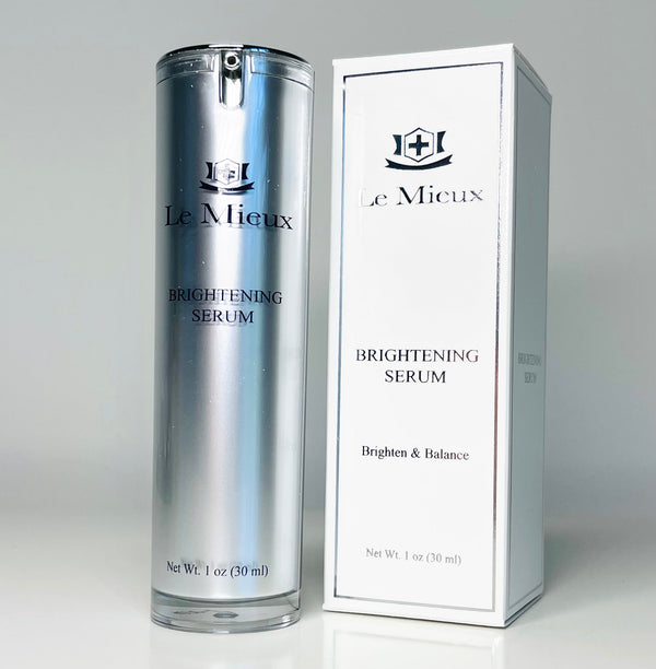 Le Mieux Brightening Serum Illuminating Potion in a clear bottle, showcasing its light golden liquid texture.