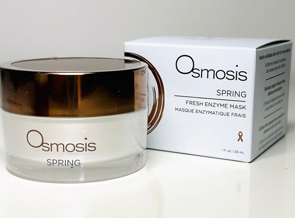 Osmosis Beauty Spring Fresh Enzyme Mask in a jar with a creamy texture, surrounded by fresh spring flowers.