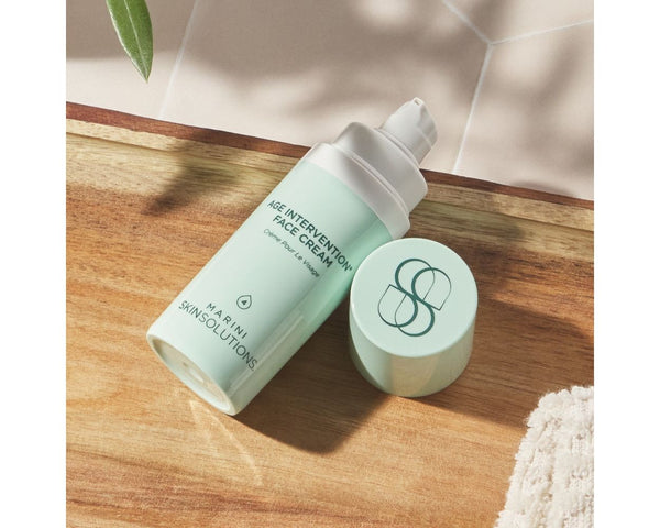 Jan Marini Age Intervention Face Cream in a jar, showcasing a creamy texture for anti-aging skincare.