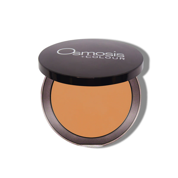 Osmosis Beauty Mineral Pressed Base in terracotta shade, showcasing smooth texture and compact design for makeup application.