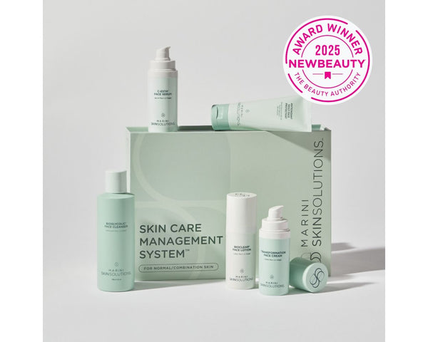 Jan Marini Skin Care Management System for dark spots, featuring a stack of labeled skincare products in elegant packaging.