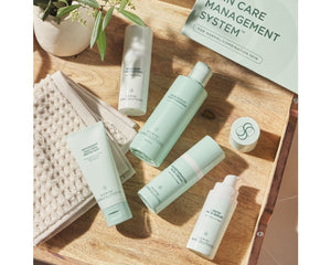 Jan Marini Skin Care Management System for dark spots, featuring various skincare products in sleek packaging.